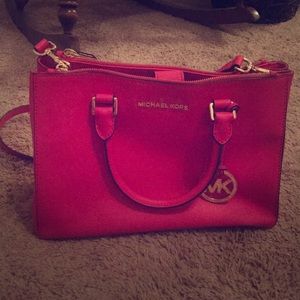 Michael Kors pink purse with strap